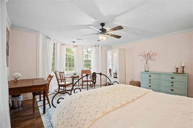 bedroom with ceiling fan, ornamental molding, and dark hardwood / wood-style floors