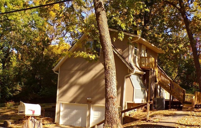 view of side of property featuring a garage