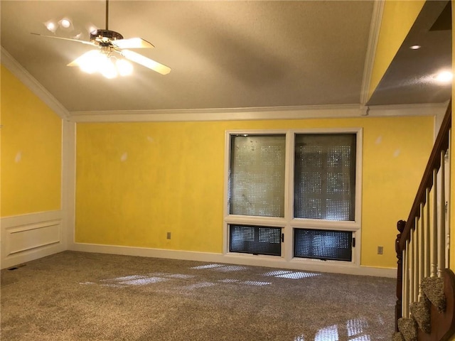 spare room featuring vaulted ceiling, ceiling fan, ornamental molding, and carpet floors