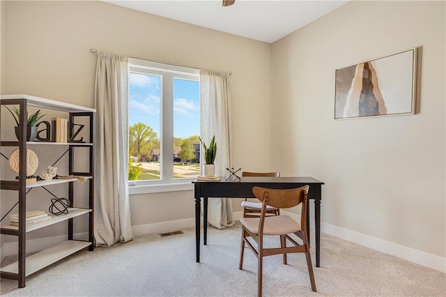 home office with baseboards, visible vents, and carpet