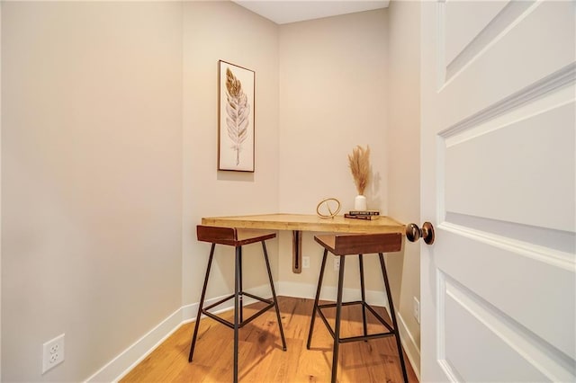 office featuring light wood finished floors and baseboards