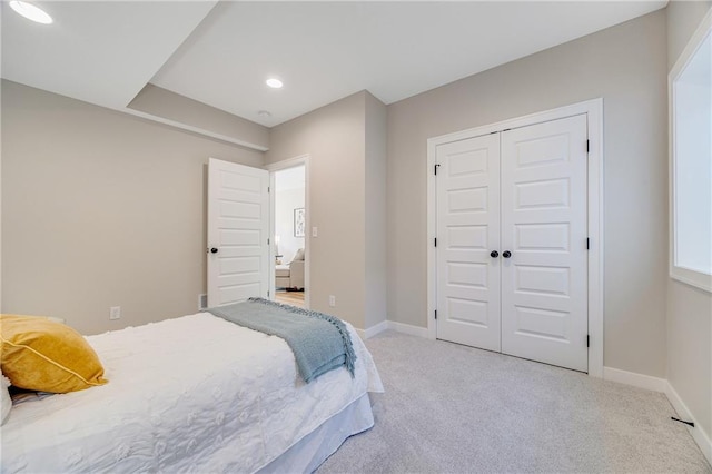 carpeted bedroom with recessed lighting, a closet, and baseboards
