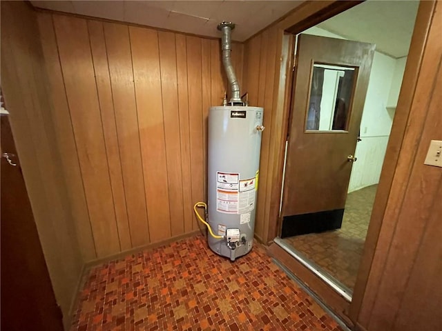 utility room featuring gas water heater