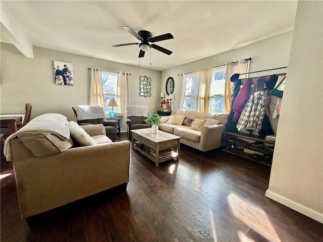 living room with dark hardwood / wood-style flooring and ceiling fan