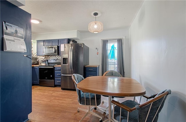 dining room featuring light wood-type flooring