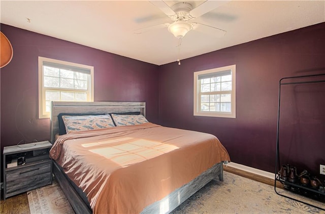 bedroom featuring hardwood / wood-style floors and ceiling fan