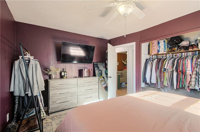 bedroom featuring ceiling fan and a closet