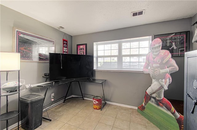 rec room featuring a textured ceiling