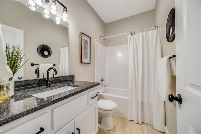 full bathroom featuring toilet, shower / tub combo with curtain, vanity, and wood finished floors