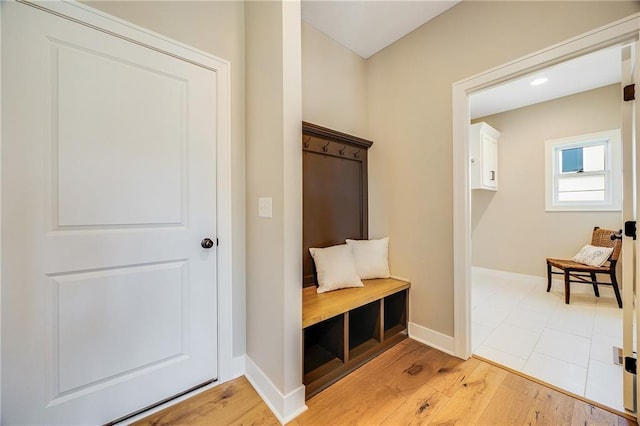 mudroom with baseboards and light wood finished floors