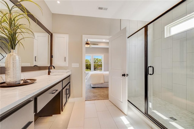 full bathroom featuring vanity, tile patterned floors, visible vents, and a stall shower