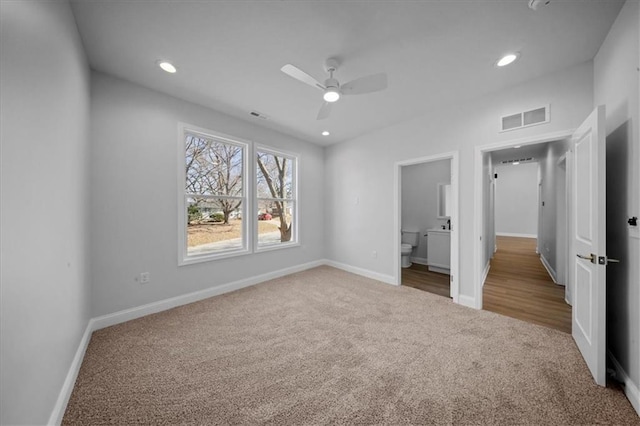 unfurnished bedroom featuring recessed lighting, visible vents, and carpet floors