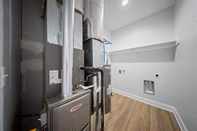 utility room with heating unit