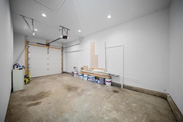 garage with recessed lighting, baseboards, and a garage door opener