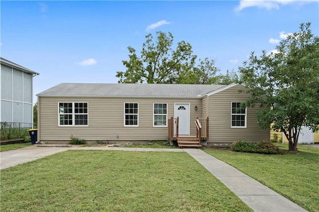 ranch-style home featuring a front yard