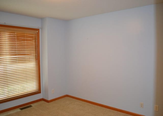 unfurnished room featuring carpet floors