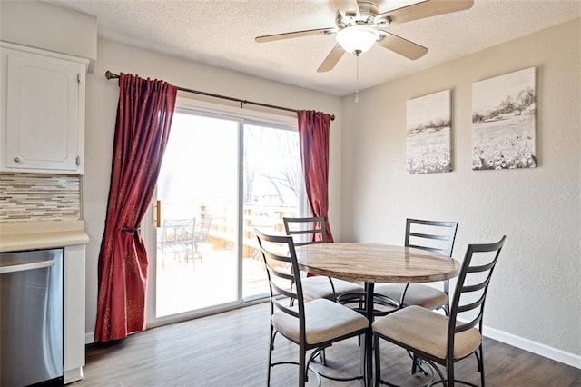 dining space featuring ceiling fan, a textured ceiling, and light wood-type flooring