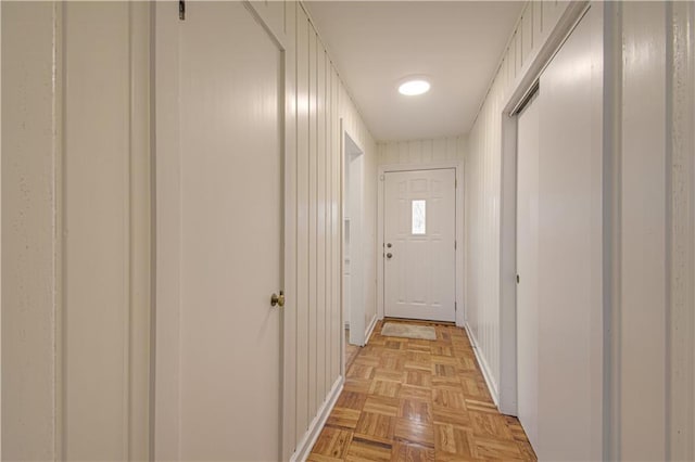 corridor with light parquet flooring