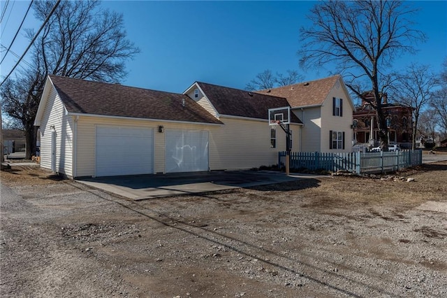 view of side of property featuring a garage