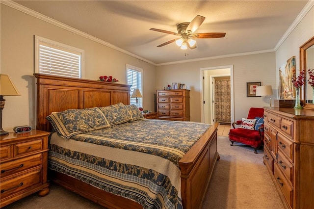 carpeted bedroom featuring ornamental molding and ceiling fan