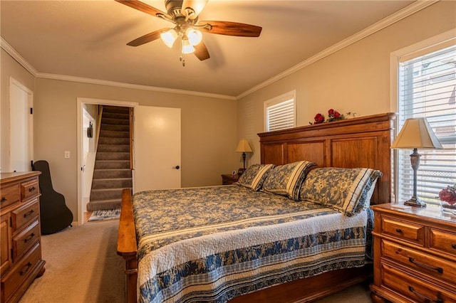 bedroom with light carpet, multiple windows, and ornamental molding