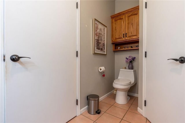 bathroom with tile patterned flooring and toilet