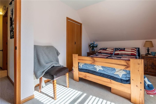 carpeted bedroom featuring vaulted ceiling