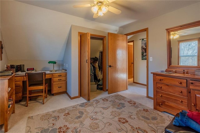 bedroom with light carpet, vaulted ceiling, and ceiling fan