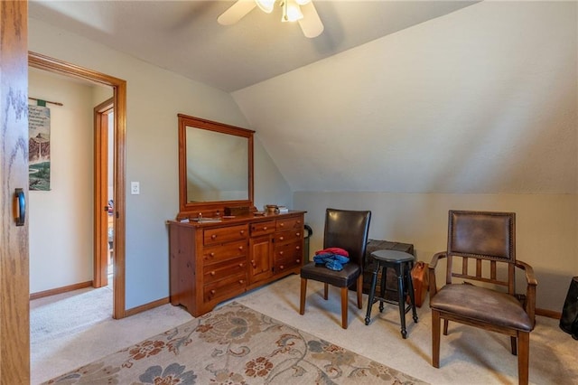 sitting room featuring vaulted ceiling, light colored carpet, and ceiling fan