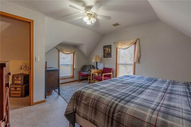 bedroom featuring light carpet, multiple windows, and lofted ceiling