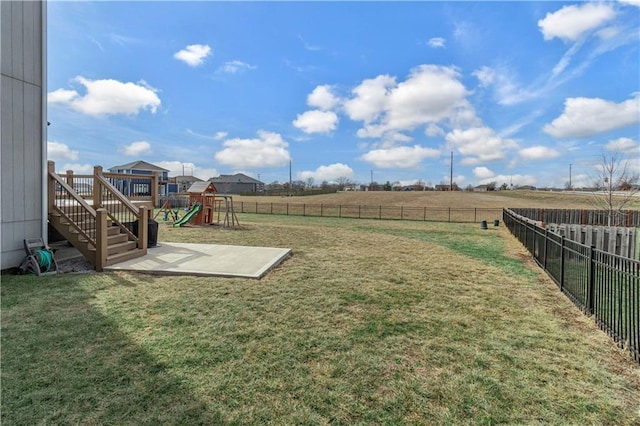 view of yard featuring a rural view and a playground