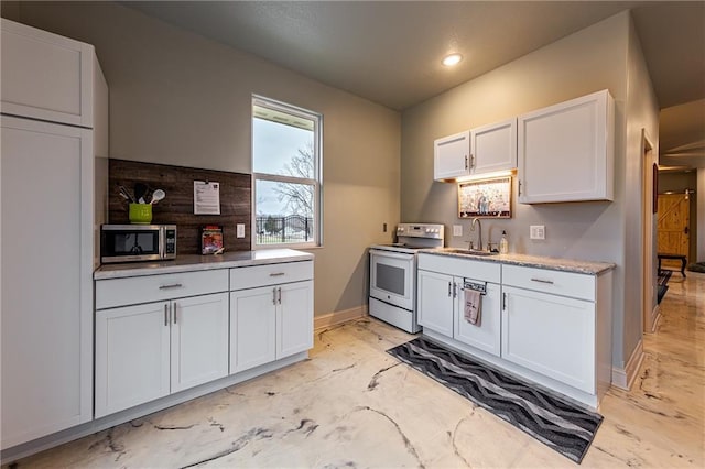 kitchen featuring white cabinetry, white electric stove, and sink