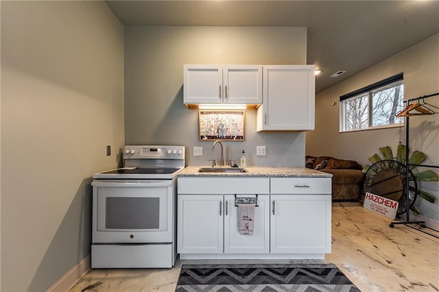 kitchen with white cabinetry, white electric range, and sink