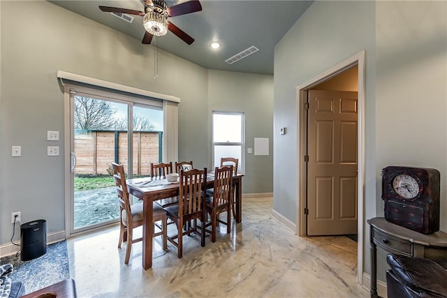 dining room featuring baseboards, a ceiling fan, and visible vents