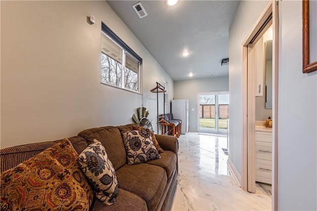living room with visible vents and recessed lighting
