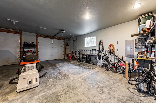 garage featuring a garage door opener and electric panel