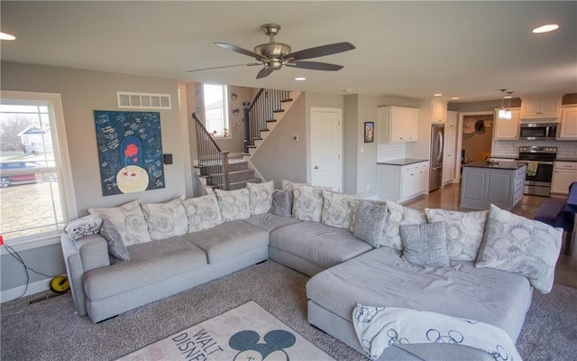 living room featuring ceiling fan