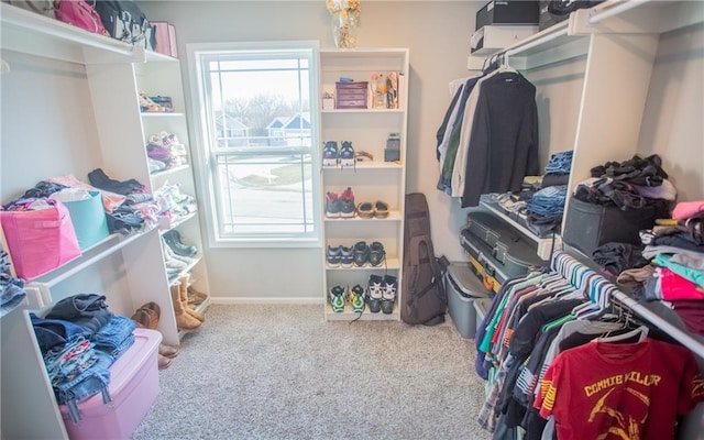 spacious closet with carpet flooring