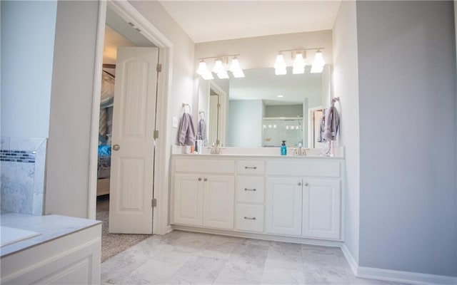 bathroom with vanity and a shower with door