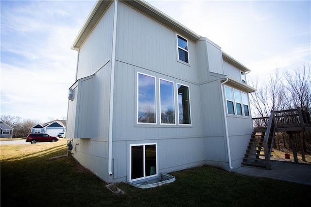 rear view of house with a yard