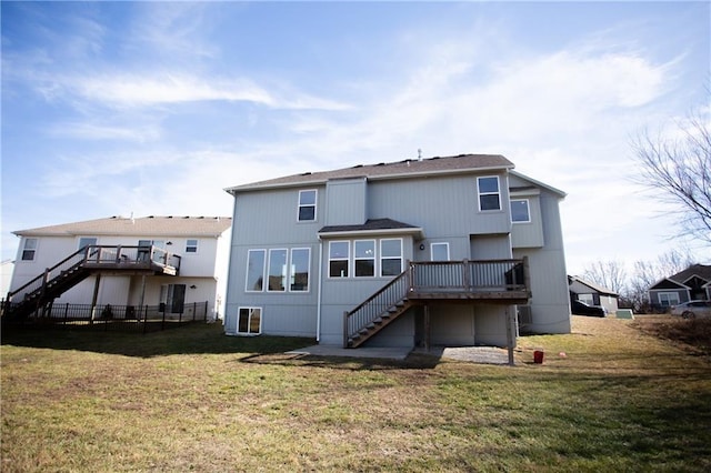 rear view of property with a wooden deck and a yard