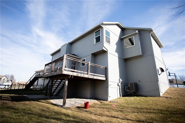 back of house featuring a yard, central air condition unit, and a deck