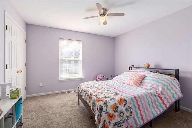 bedroom with visible vents, carpet, baseboards, and ceiling fan