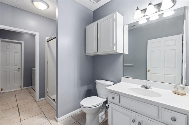 full bath with tile patterned floors, toilet, a shower stall, baseboards, and vanity