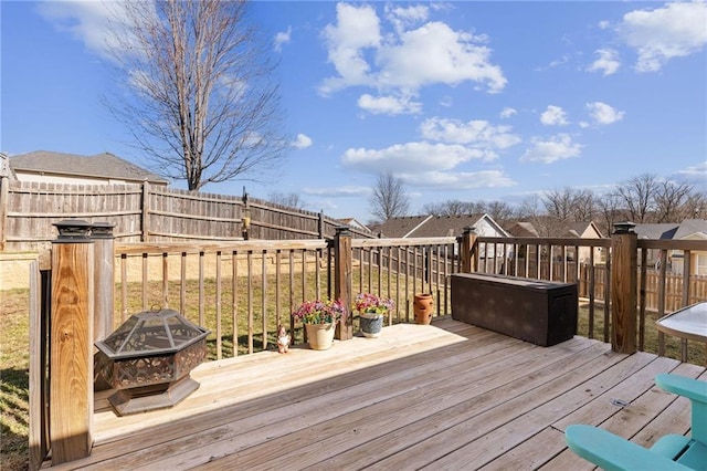 wooden terrace with fence and an outdoor fire pit