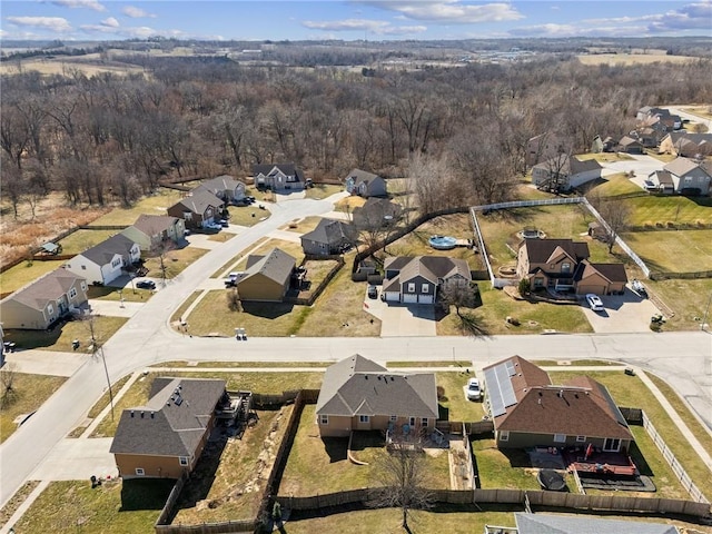 drone / aerial view with a view of trees and a residential view