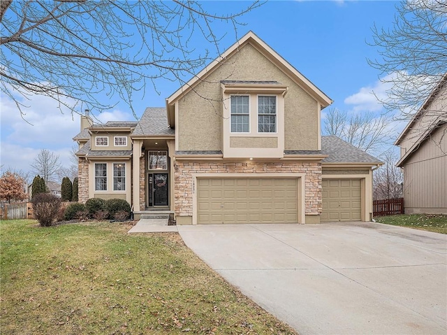 view of front of home featuring a garage and a front yard