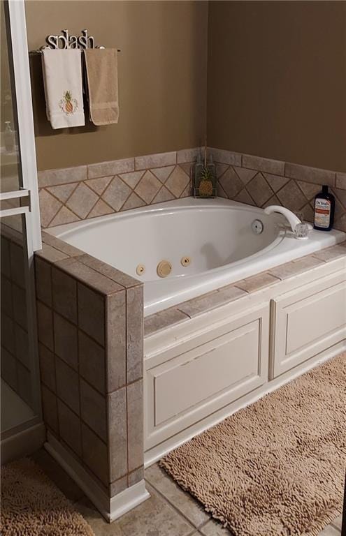 bathroom with plus walk in shower and tile patterned flooring