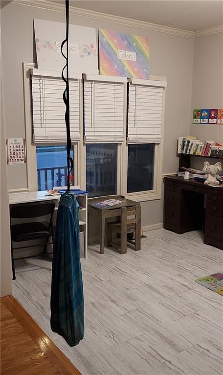 office space with hardwood / wood-style floors and crown molding