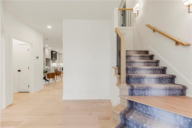 stairway with wood-type flooring